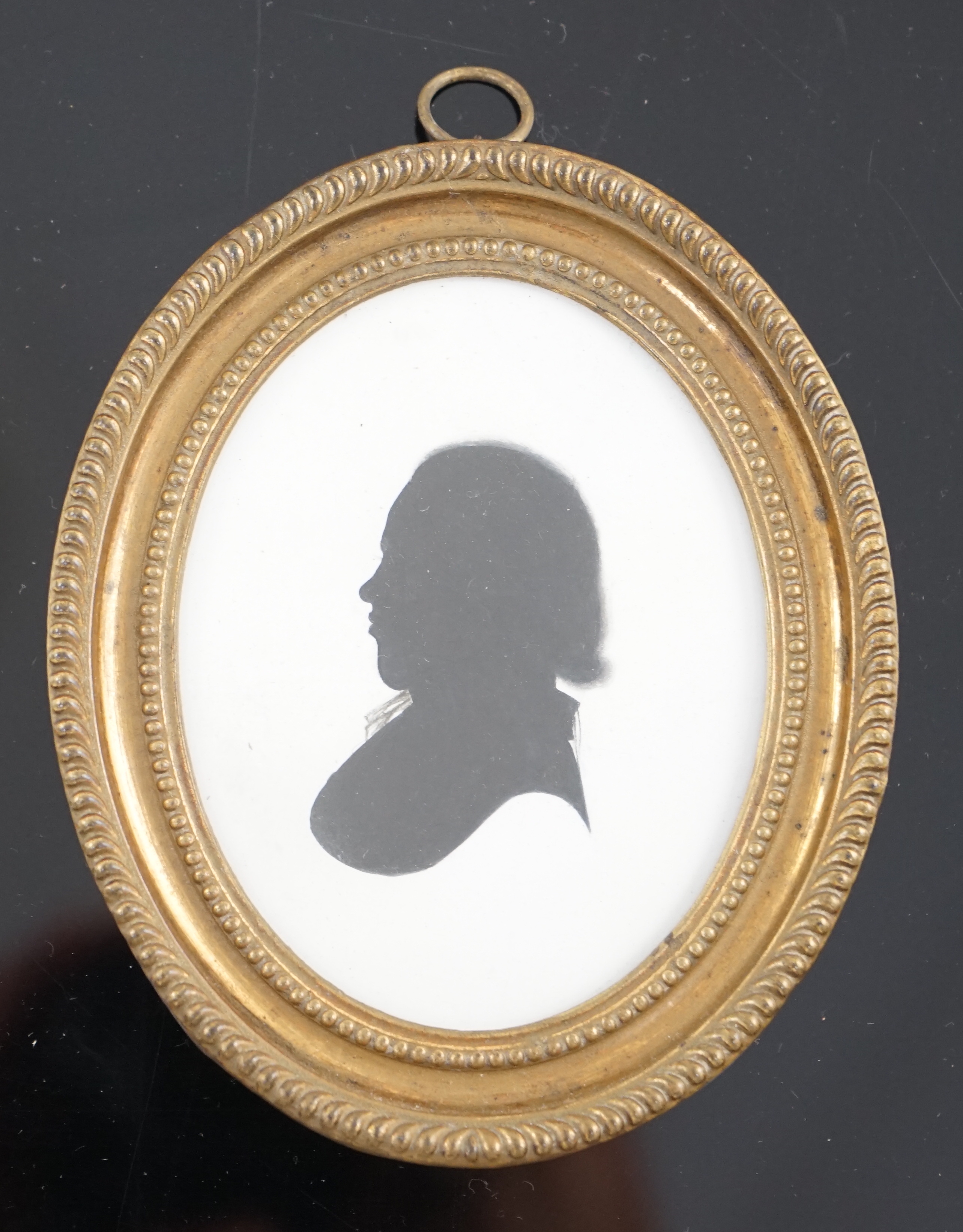 John Miers (1756-1821), Silhouette of a young man, painted plaster, 8.8 x 7cm.